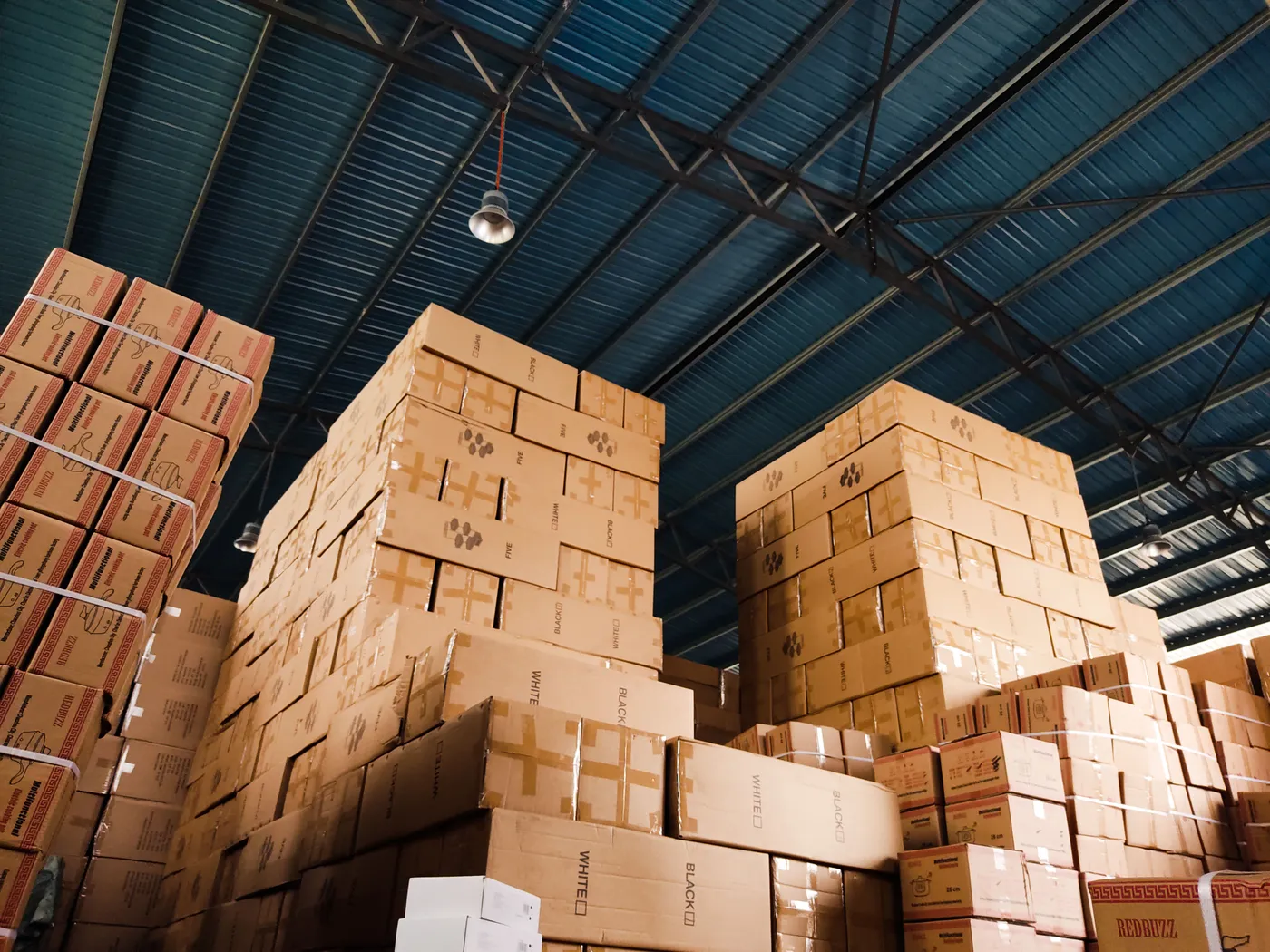 Solid-piled cardboard cartons stacked high in a warehouse, high-piled combustible storage
